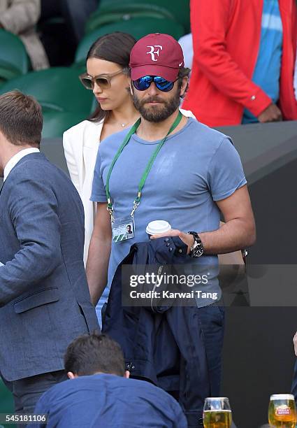 Bradley Cooper and Irina Shayk attend day nine of the Wimbledon Tennis Championships at Wimbledon on July 06, 2016 in London, England.