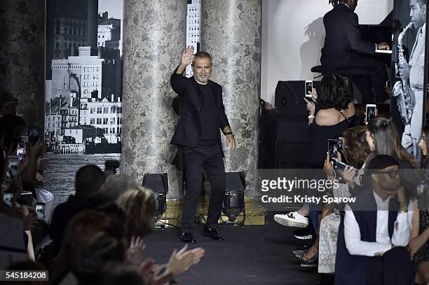 Elie Saab acknowledges the audience during the Elie Saab Haute Couture Fall/Winter 2016-2017 show as part of Paris Fashion Week on July 6, 2016 in...