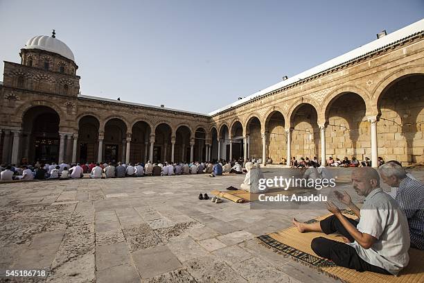 Muslims perform Eid al-Fitr prayer during the Eid al-Fitr holiday at Al-Zaytuna Mosque in Tunis, Tunisia on July 06, 2016. Eid al-Fitr is a religious...