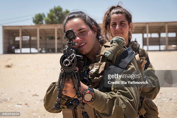 Soldiers practice in the shooting range as part of their daily combat training on July 6, 2016 in Nitzana, Israel.The first mixed-sex Karakal combat...