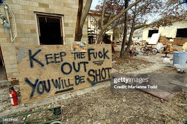 Sign is seen on a St. John's Street home on September 4, 2005 in Biloxi, Mississippi. The homes renters, Ryan Winiecki and Joe Griffin escaped during...