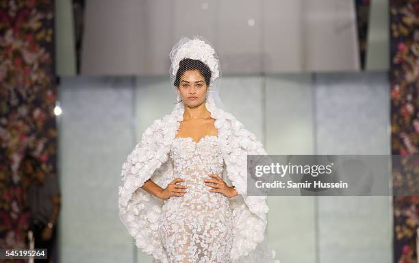 Shanina Shaik prepares backstage to walk as the bride during the Ralph & Russo Haute Couture Fall/Winter 2016-2017 show as part of Paris Fashion Week...