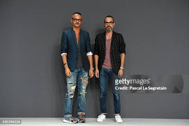 Viktor Horsting and Rolf Snoeren pose on the runway during the Viktor & Rolf Haute Couture Fall/Winter 2016-2017 show as part of Paris Fashion Week...