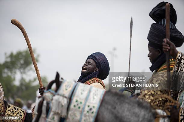 Man on horse back chants while waiting for the arrival of the Emir of Kano after the parade during the Durbar Festival in Kano, northern Nigeria on...