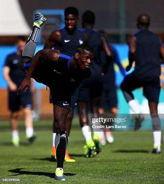 Paul Pogba of France warms up during a France training session ahead of their UEFA Euro 2016 Semi final against Germany on July 6, 2016 in Marseille,...