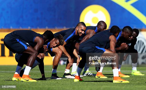 Dimitri Payet of France warms up during a France training session ahead of their UEFA Euro 2016 Semi final against Germany on July 6, 2016 in...