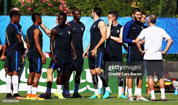 Andre-Pierre Gignac of France speaks with head coach Didier Deschamps during a France training session ahead of their UEFA Euro 2016 Semi final...