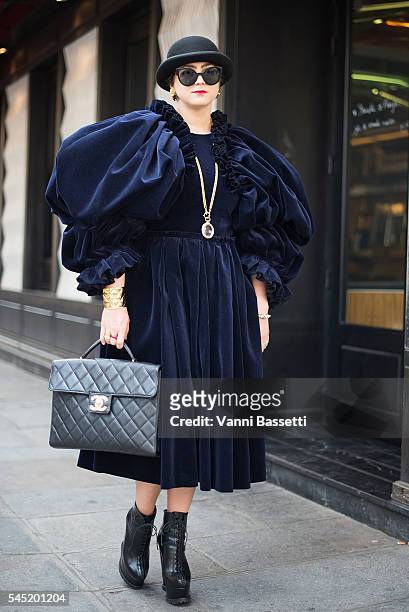 Guest poses with a Chanel bag after the Jean Paul Gaultier show during Paris Fashion Week Haute Couture FW 16/17 on July 6, 2016 in Paris, France.