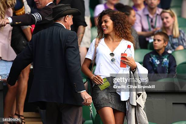 Jo-Wilfried Tsonga of France's girlfriend Noura El Shwekh looks on from Centre Court on day nine of the Wimbledon Lawn Tennis Championships at the...