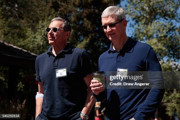 Bob Iger, chief executive officer of The Walt Disney Company, walks with Tim Cook, chief executive officer of Apple Inc., as they attend the annual...