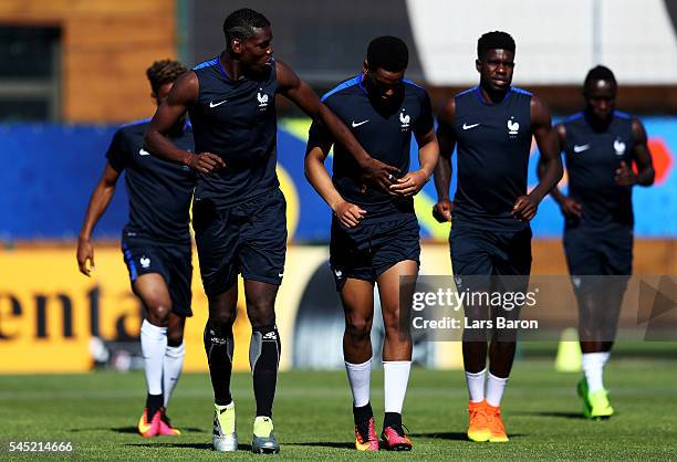 Paul Pogba of France jokes with Anthony Martial of France during a France training session ahead of their UEFA Euro 2016 Semi final against Germany...