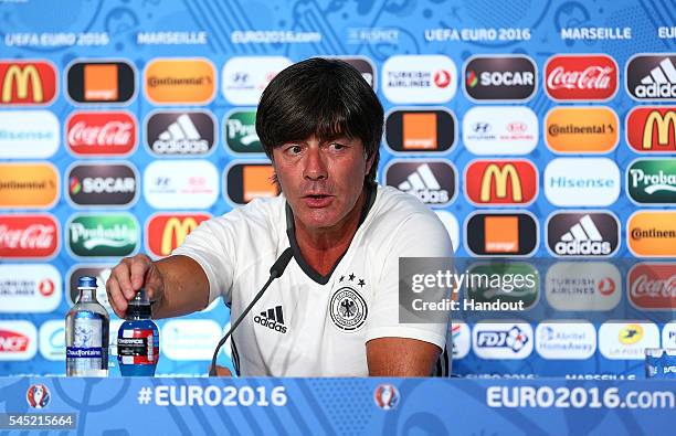 In this handout image provided by UEFA, head coach Joachim Loew faces the media during the Germany press conference at Stade Velodrome on July 6,...