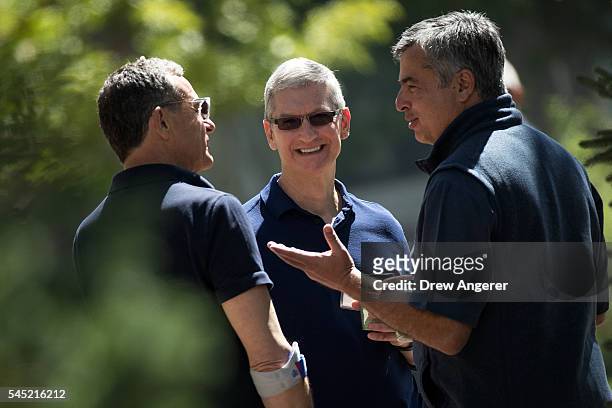 Bob Iger, chief executive officer of The Walt Disney Company, Tim Cook, chief executive officer of Apple Inc., and Eddy Cue, Apple senior vice...
