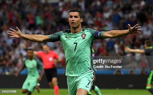 Cristiano Ronaldo of Portugal celebrates scoring the opening goal during the UEFA EURO 2016 semi final match between Portugal and Wales at Stade des...