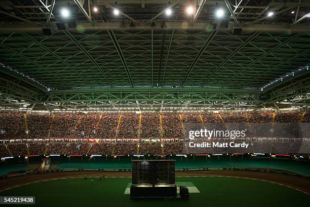 Welsh football fans gather inside the Principality Stadium which is showing the Wales v Portugal game on a giant screen on July 6, 2016 in Cardiff,...