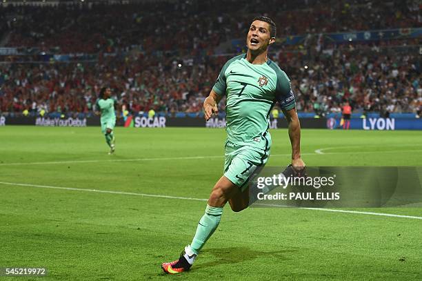 Portugal's forward Cristiano Ronaldo celebrates after scoring a goal during the Euro 2016 semi-final football match between Portugal and Wales at the...