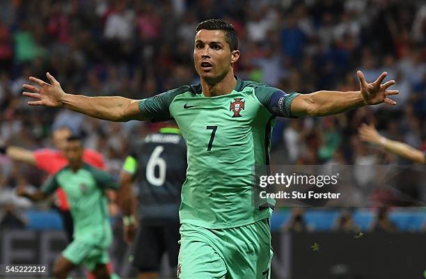 Cristiano Ronaldo of Portugal celebrates scoring the opening goal during the UEFA EURO 2016 semi final match between Portugal and Wales at Stade des...