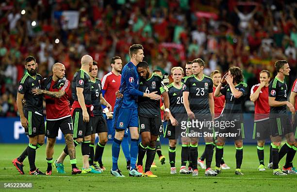 Wales players show their dejection after the UEFA EURO 2016 semi final match between Portugal and Wales at Stade des Lumieres on July 6, 2016 in...