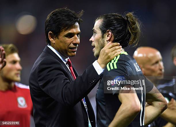 Chris Coleman manager of Wales consoles Gareth Bale of Wales after defeat in the UEFA EURO 2016 semi final match between Portugal and Wales at Stade...