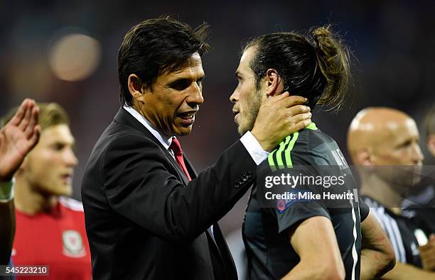 Chris Coleman manager of Wales consoles Gareth Bale of Wales after defeat in the UEFA EURO 2016 semi final match between Portugal and Wales at Stade...