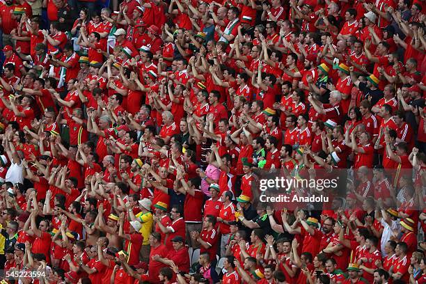 Supporters of Wales cheer up during the UEFA Euro 2016 semi final match between Portugal and Wales at Stade de Lyon in Lyon, France on July 6, 2016.