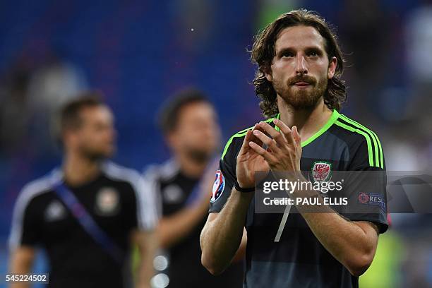 Wales' midfielder Joe Allen reacts at the end of the Euro 2016 semi-final football match between Portugal and Wales at the Parc Olympique Lyonnais...