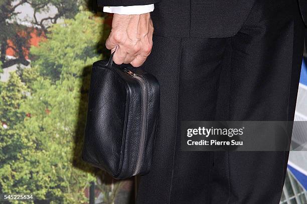 Marc Jacobs, handbag detail, attends the "The Art of Giving" Love Ball Naked Heart foundation : Photo Call as part of Paris Fashion Week on July 6,...