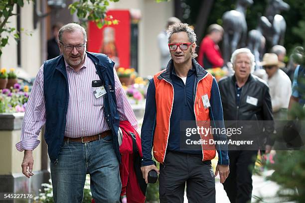 Seth Klarman, founder of Baupost Group, walks with Alex Karp, chief executive officer of Palantir Technologies, as they attend the annual Allen &...