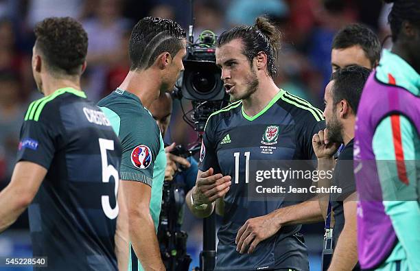 Cristiano Ronaldo of Portugal greets Gareth Bale of Wales following the UEFA Euro 2016 semi-final between Wales and Portugal at Parc OL, Stade des...