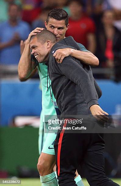 Cristiano Ronaldo of Portugal celebrates the victory with Pepe following the UEFA Euro 2016 semi-final between Wales and Portugal at Parc OL, Stade...