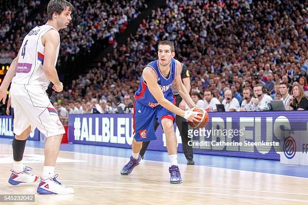 Jeremy Leloup of France is looking to pass the ball against Milos Teodosic of Serbia during the International Friendly game between France v Serbia...