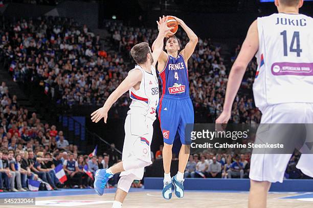 Thomas Heurtel of France shoots the ball against Stefan Markovic of Serbia during the International Friendly game between France v Serbia at...