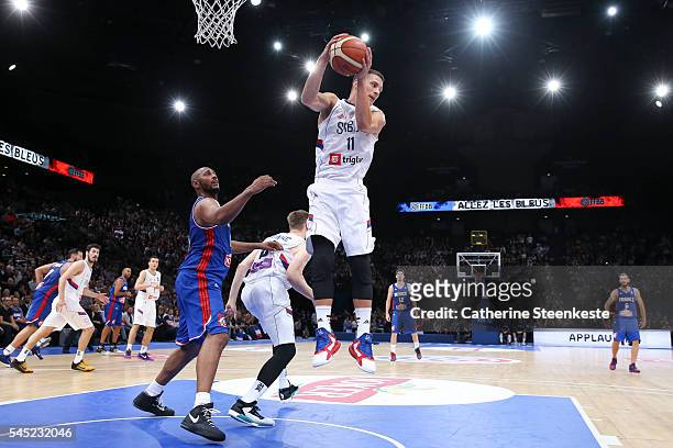 Nemanja Nedovic of Serbia is at the rebound against Boris Diaw of France during the International Friendly game between France v Serbia at...