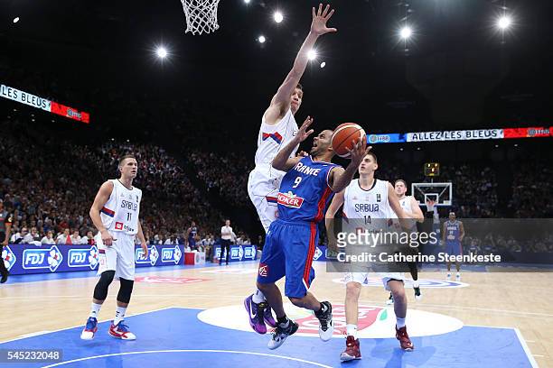 Tony Parker of France is at the basket against Bogdan Bogdanovic of Serbia during the International Friendly game between France v Serbia at...
