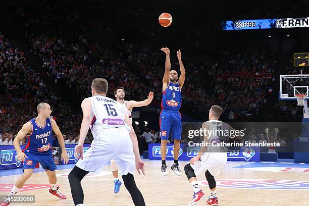 Tony Parker of France is shooting the ball against Stefan Markovic, Vladimir Stimac, and Nemanja Nedovic of Serbia during the International Friendly...