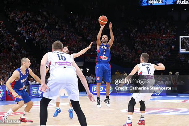 Tony Parker of France is shooting the ball against Stefan Markovic, Vladimir Stimac, and Nemanja Nedovic of Serbia during the International Friendly...