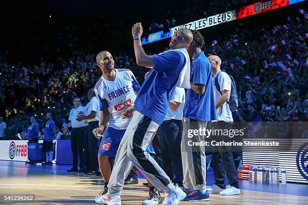 Tony Parker of France is entering the court and is joking with Nicolas Batum prior to the International Friendly game between France v Serbia at...