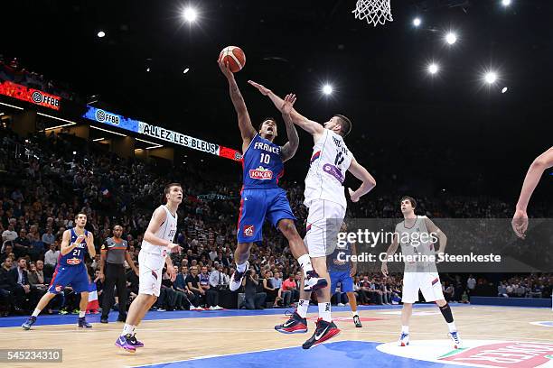 Edwin Jackson of France is at the basket against Stefan Bircevic of Serbia during the International Friendly game between France v Serbia at...