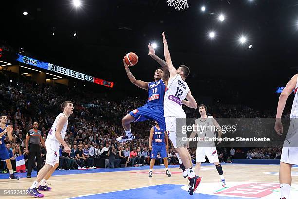 Edwin Jackson of France is at the basket against Stefan Bircevic of Serbia during the International Friendly game between France v Serbia at...