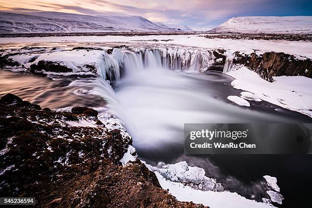 close up powerful godafoss falls at sunset - akureyri stockfoto's en -beelden