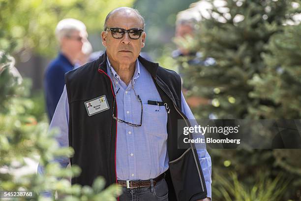 Muhtar Kent, chairman and chief executive officer of Coca-Cola Co., walks the grounds after the morning session of the Allen & Co. Media and...