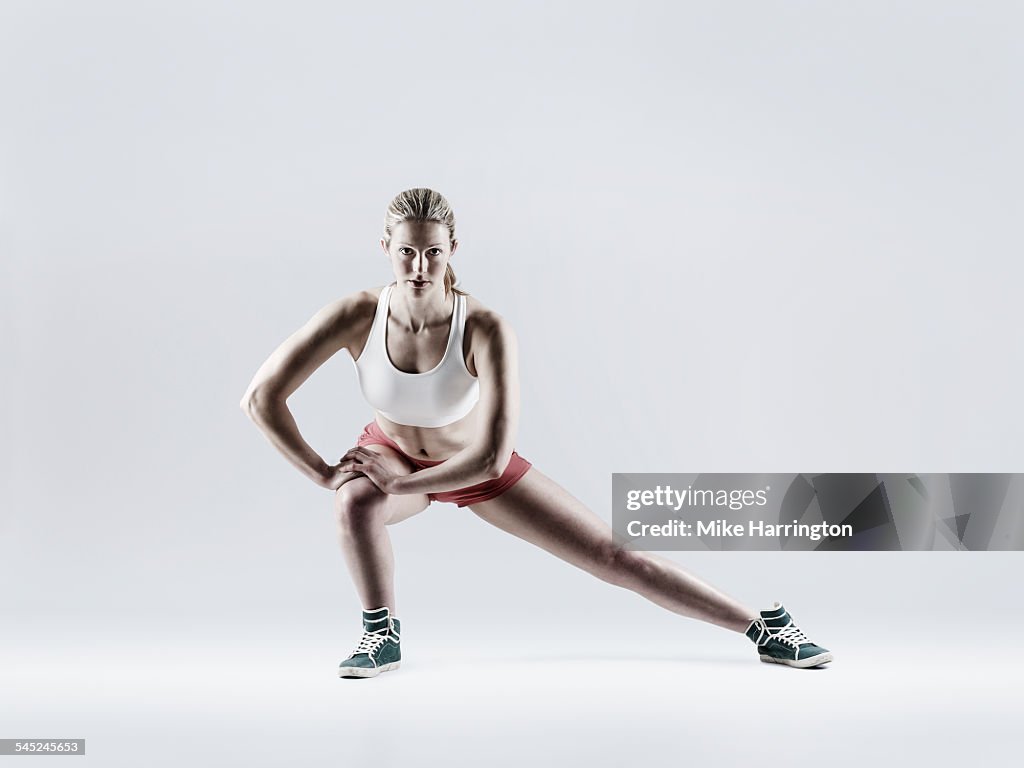 Female doing side lunge as part of her exercise.