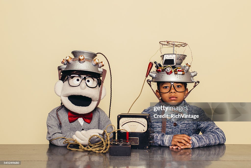 Young Boy and Puppet Dressed as Nerds Testing Telepathy