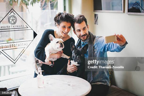 young couple taking a selfie photo - selfie with bottle stock pictures, royalty-free photos & images