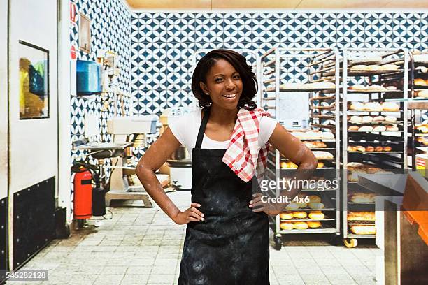 smiling baker standing in bakery - chef in kitchen bildbanksfoton och bilder