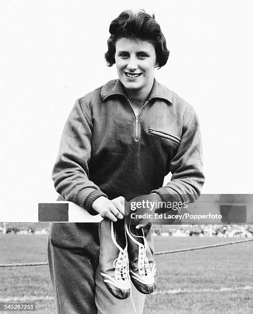 Portrait of British sprinter Dorothy Hyman on a running track during training on 3rd April 1960. Later in the year she won Olympic silver and bronze...