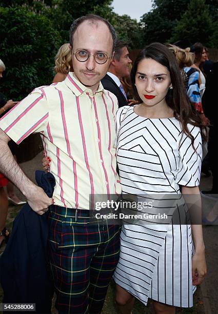 Nimrod Kamer and Natasha Arselan attend the Serpentine Summer Party co-hosted by Tommy Hilfiger at the Serpentine Gallery on July 6, 2016 in London,...