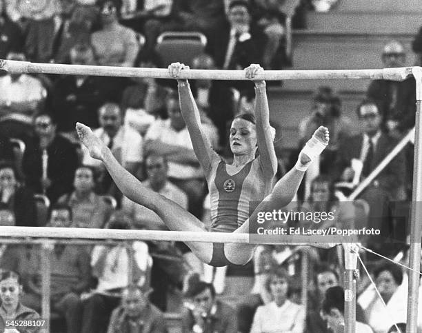 East German gymnast Karin Janz in action competing for the East Germany team on the uneven bars to finish in 2nd place silver medal position in the...