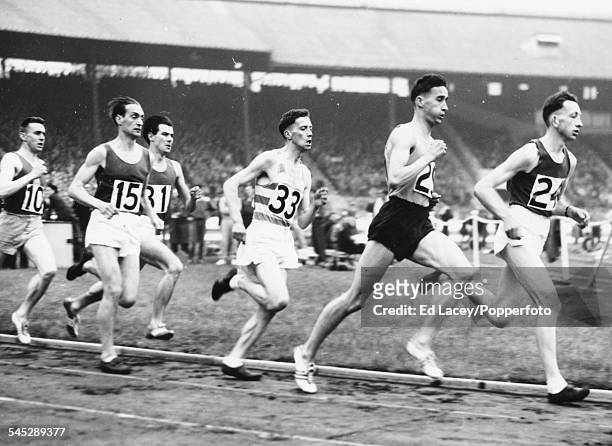 British athlete Gordon Pirie lies in second place during the one mile heat at the Inter County Championships, White City, London, May 28th 1955.
