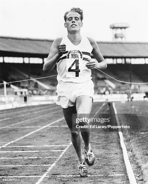 British Olympic runner Derek Ibbotson wins his race at a Great Britain versus Czech Republic track and field event at White City, London, August 1956.